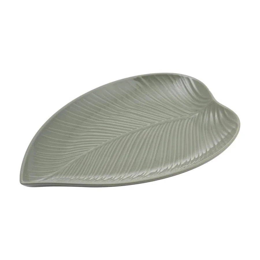 Green leaf-shaped ceramic plate on a white background