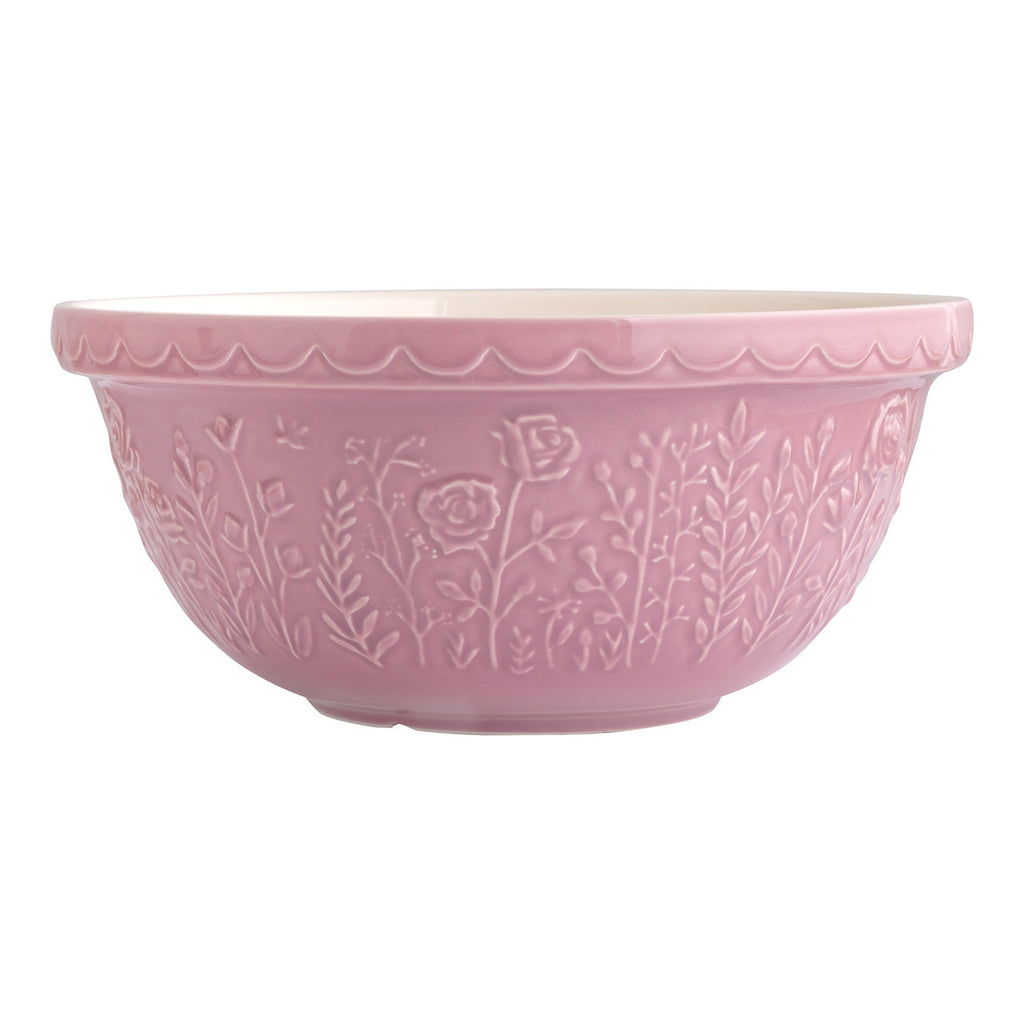 Pink ceramic bowl with floral patterns on a white background
