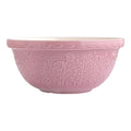 Pink ceramic bowl with floral patterns on a white background