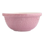 Pink ceramic bowl with floral patterns on a white background