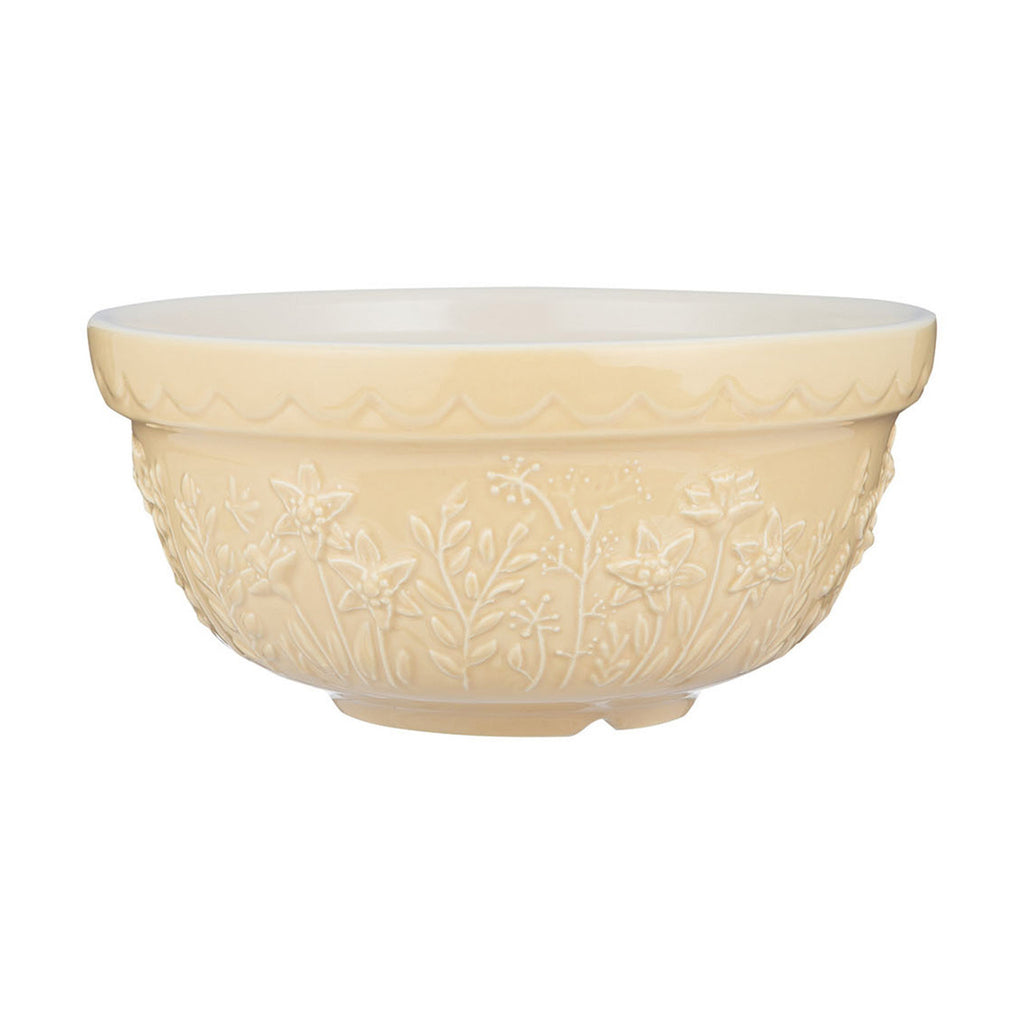 Cream-colored ceramic bowl with floral patterns on a white background