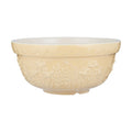 Cream-colored ceramic bowl with floral patterns on a white background