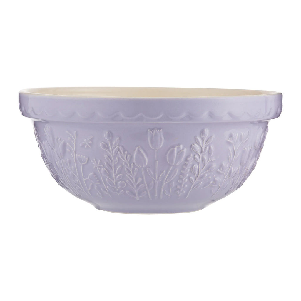 Purple ceramic bowl with floral patterns on a white background