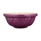 Purple ceramic bowl with floral patterns on a white background