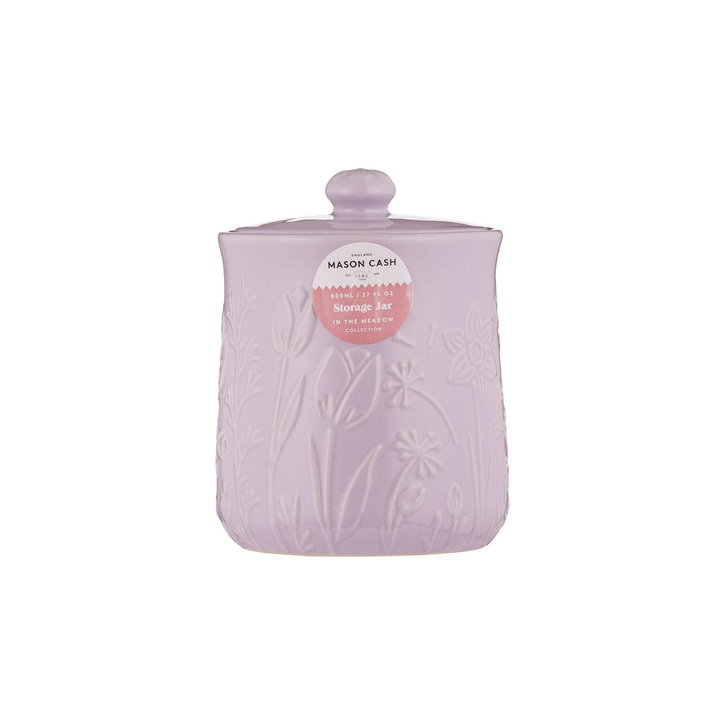 Pink textured storage jar with a label on a white background