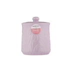 Pink textured storage jar with a label on a white background