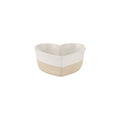 Heart-shaped ceramic bowl with two-tone design on a white background